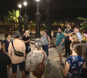 Attendees listen to “spook-tacular” tales outside Jackson Square during the ghost tour.