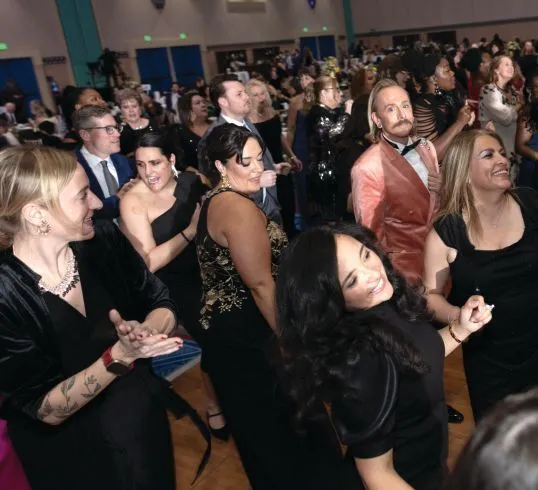 Attendees show off their smooth moves on the dance floor. PHOTOGRAPHY BY HUGHES FIORETTI PHOTOGRAPHY