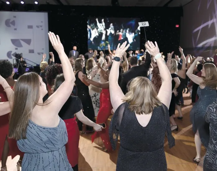 Hands up for the dance competition. PHOTOGRAPHY BY HUGHES FIORETTI PHOTOGRAPHY