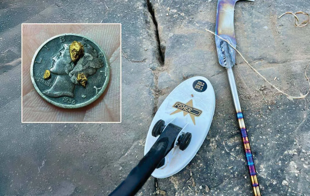 Small gold nuggets with a dime for scale