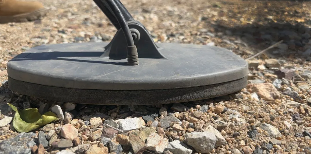 Metal detector coil on the ground