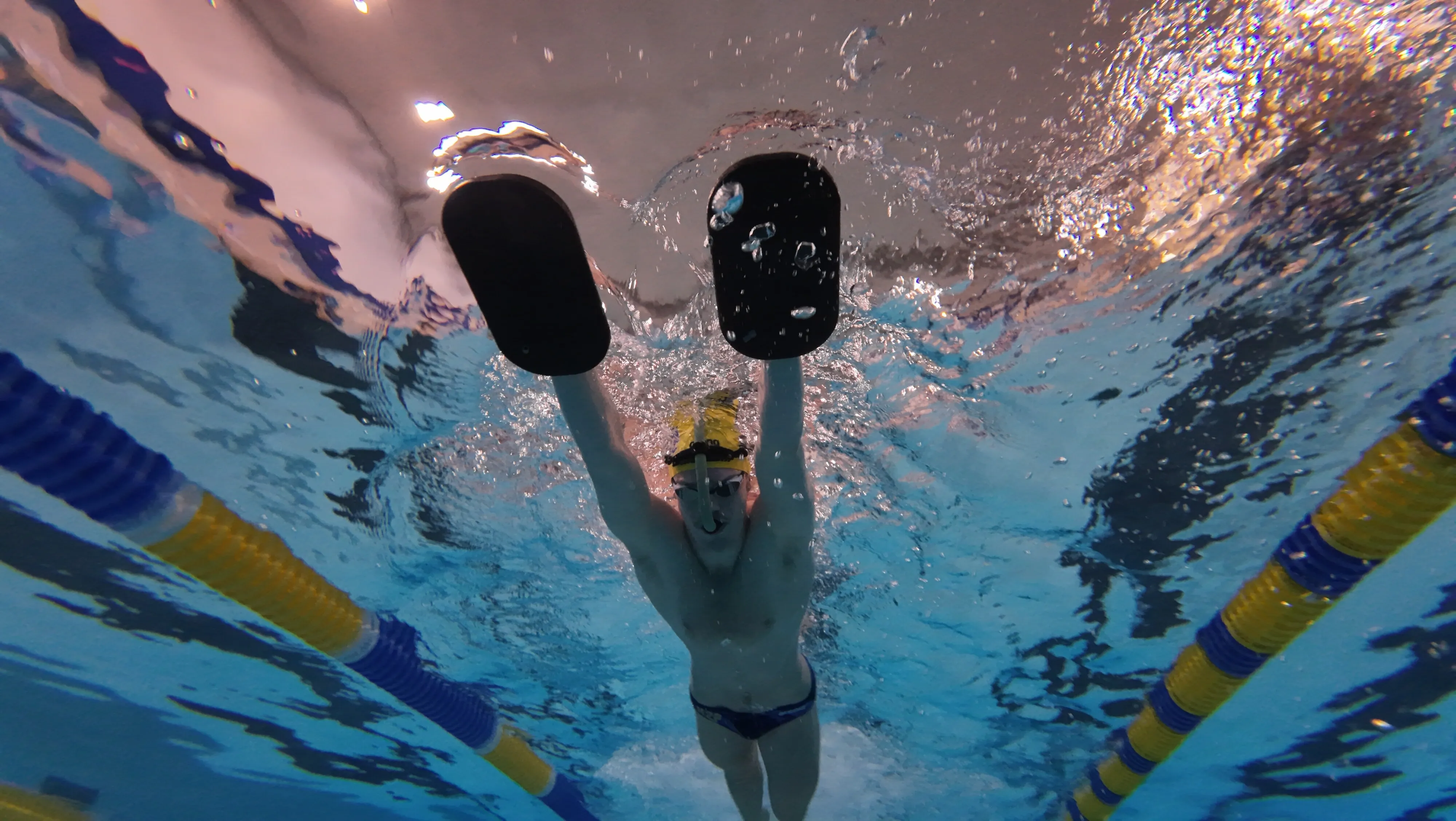 Mason Leach is using dual boards for body position and kick alignment